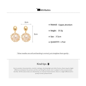Detail view of vintage pearl drop earrings showing dimensions 3cm by 2cm and weight 10.3g