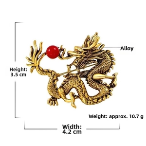 Detailed view of vintage gold dragon brooch with size specs 3.5cm by 4.2cm