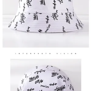 Detail of white cotton bucket hat with black street style graffiti font printing