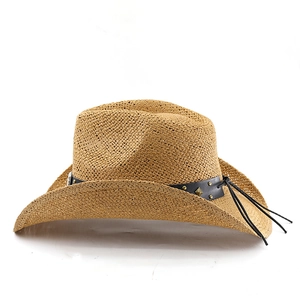 Detail of straw cowboy hat with black leather band and retro metal studs on white background