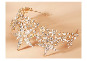 Detail of luxury gold star bridal crown with sparkling crystals for wedding party