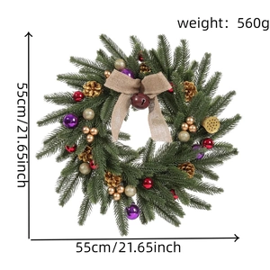 Detailed close-up of a 55cm Christmas wreath with gold pine cones and burlap bow