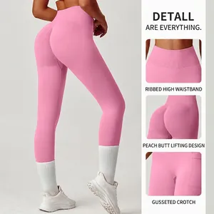 Pink high waisted yoga pants with ribbed texture and peach butt lift design for women