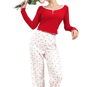 Women's dark red ribbed pajama set with lace trim and white crown print pants
