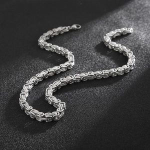Close-up of silver stainless steel Byzantine chain necklace with lobster clasp
