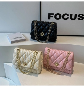 Close-up of quilted PU leather shoulder bags with gold chain straps in multiple colors