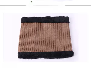 Detail view of brown knit winter neck warmer with black faux fur trim and soft lining