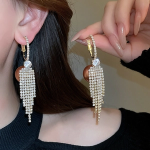 Elegant gold drop earrings with brown pearls and sparkling rhinestone tassel fringe