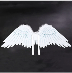 Close-up of white feathered angel wings with shoulder straps for cosplay costume outfits