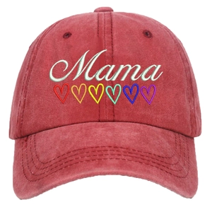 Detail of white Mama embroidery and rainbow hearts on washed red cotton baseball cap