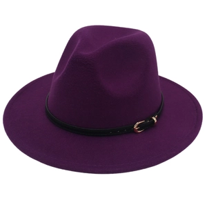 Detail of dark purple wool fedora with a black leather strap and gold metal buckle