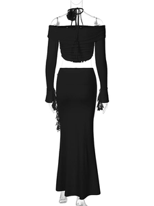 Rear view of black two-piece set featuring off-shoulder top and slim fishtail maxi skirt