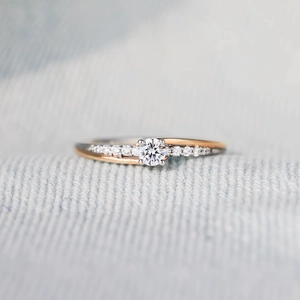 Elegant S925 sterling silver two-tone ring with sparkling crystals in a cross design