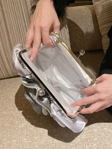Silver satin pleated evening clutch bag with crystal clasp and chain strap