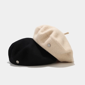 Vintage wool beret hat for women with metal button detail in black and beige