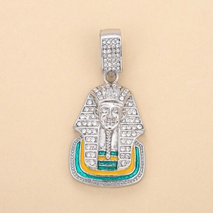 Macro detail of Egyptian Pharaoh head pendant with clear diamonds and colorful enamel