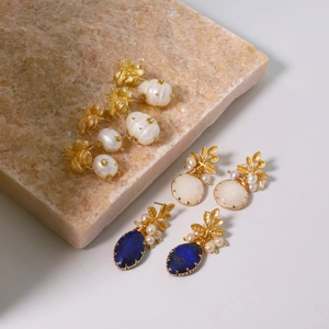 Three pairs of vintage 925 silver gold earrings with natural freshwater pearls and gems