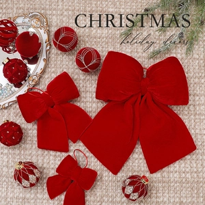 Classic red velvet Christmas bows and textured ball ornaments for holiday tree decoration