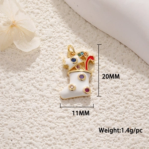 Macro view of Christmas stocking pendant with colored zircons and size details