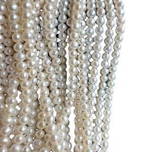 Strands of 4-5mm white freshwater pearls with high luster and smooth round surface