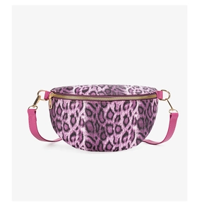 Close-up of leopard print waist bag with gold zippers and pink leather strap details