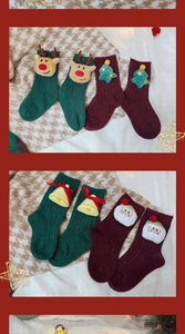 Detailed close-up of thick Christmas socks featuring 3D reindeer and Santa plush decor
