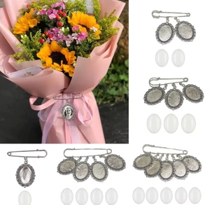 Detailed view of DIY silver vintage photo tray brooches with oval glass covers