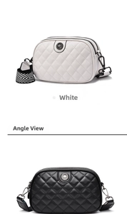 Detail view of quilted crossbody bags with floral metal badges and wide woven straps