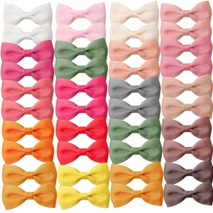 Set of 36 colorful grosgrain ribbon swallowtail bow hair clips for girls in a grid layout