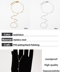 Detail of star finger chain bracelet in polished stainless steel with PVD plating