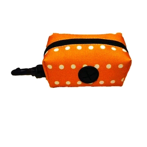 Orange polka dot canvas pet waste bag dispenser with hook and rubber opening detail