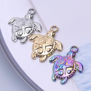 Detailed relief of sea turtle pendants in gold, silver, and iridescent steel finishes