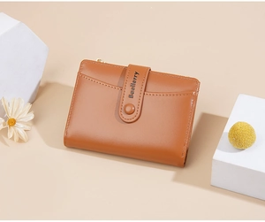 Close-up of caramel brown bifold wallet featuring matte leather and front card slots