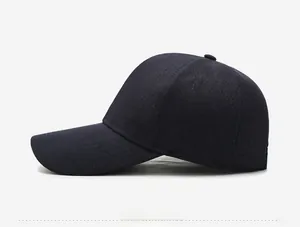 Detail shot of navy blue baseball cap with a silver lightning logo and knit texture