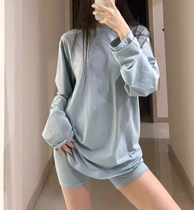 Close-up of light blue long-sleeve T-shirt and cycling shorts in soft knit fabric