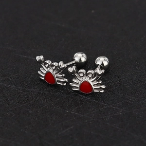 Detailed macro of red enamel crab earrings with secure silver screw ball backings