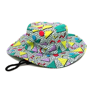 Detail of colorful geometric print sun hat with wide brim and adjustable chin strap