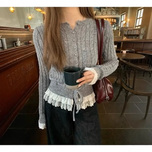 Grey knit cardigan with lace hem and heart patterns, styled for casual daily wear