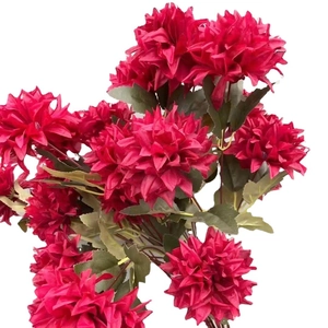 Deep red artificial chrysanthemum bouquet with green leaves on white background
