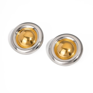 Detailed close-up of two-tone round button earrings with a polished gold center and silver rim