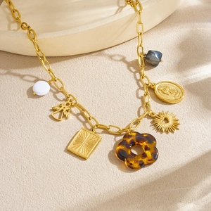 Vintage gold layered necklace with leopard flower, angel charms and acrylic beads