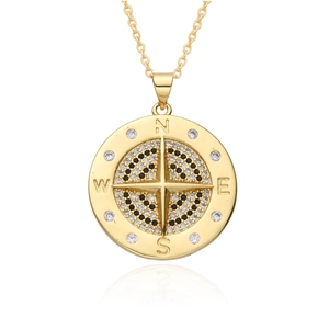 Golden compass pendant necklace with black and white zircon star on white background