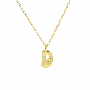 Macro shot of polished 18k gold plated puffy letter D bubble pendant on a thin O-chain