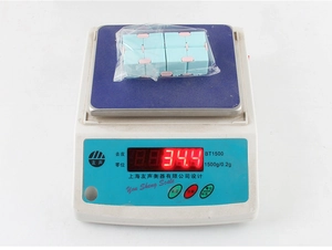 Infinity Cube stress relief toy in macaron colors weighing 34.4g on a scale