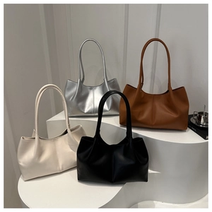 Detailed group shot of large capacity faux leather tote bags in four trendy colors