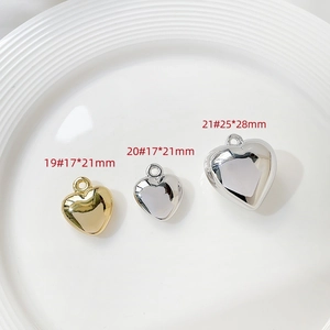 Three sizes of resin heart charms in gold and silver with precise dimension labels