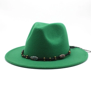 Detail of green wool fedora hat featuring ethnic style braided band and metallic beads