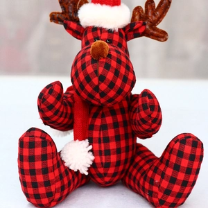 Christmas deer plush doll in red and black buffalo plaid with a Santa hat and scarf