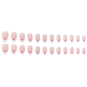 French tip press on nails with red heart designs and a glossy nude finish