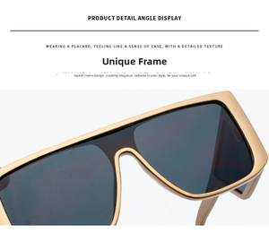 Close-up of oversized retro oversized sunglasses with matte metal frame and shield lenses